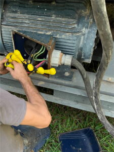 a skilled technician is inspecting the intricate internal components of an industrial motor